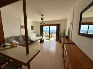 a living room with a view of the ocean at Atlantic View Tenerife South in Arona