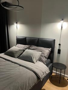 Postel nebo postele na pokoji v ubytování Apartament NP