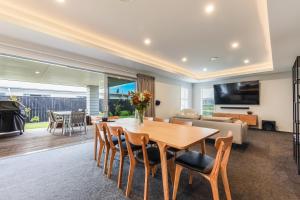 a living room with a wooden table and chairs at 39Carmine Five Star 4-bedroom Holiday Home in Appleby