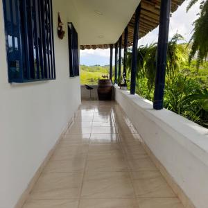 a hallway of a house with a view of a field at Casa Alto Bonito in Quimbaya