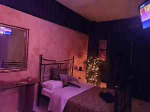a bedroom with a bed and a christmas tree at Anatolia in Veria