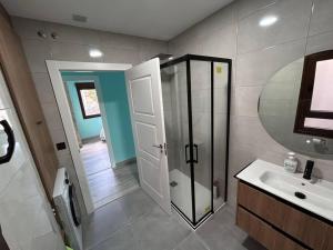 a bathroom with a shower and a sink at Vistas Sobia San Martín de teverga in San Martín +12 photos