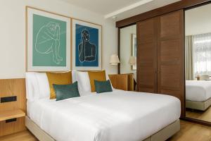 A bed or beds in a room at AC Hotel Gava Mar