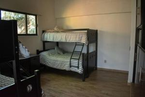 Katil atau katil-katil dalam bilik di Casa Atlixco con alberca +32 gambar