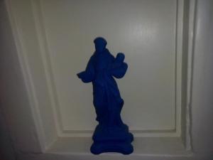 a blue statue of a jesus statue on a wall at River View Penthouse in Lisbon