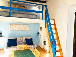 a living room with a bunk bed and a couch at Casetta San Giovanni in Pizzo