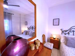 Ένα ή περισσότερα κρεβάτια σε δωμάτιο στο Tropicalidays Mar Relax Las Galletas