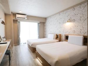En eller flere senge i et værelse på Hotel 385 + 53 billeder