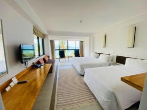 TV a/nebo společenská místnost v ubytování Rayong Resort Hotel โรงแรมระยองรีสอร์ท