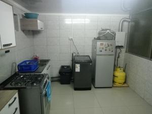Η κουζίνα ή μικρή κουζίνα στο Departamento sector centro