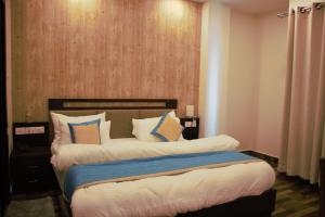Postel nebo postele na pokoji v ubytování Hotel Tulip Pvt Ltd