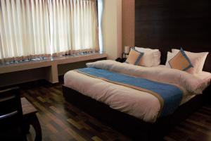 Postel nebo postele na pokoji v ubytování Hotel Tulip Pvt Ltd