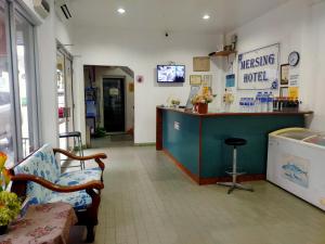 a waiting room with a counter and a bar at Mersing Hotel in Mersing +21 photos