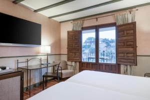 Postel nebo postele na pokoji v ubytování AC Hotel Ciudad de Toledo by Marriott