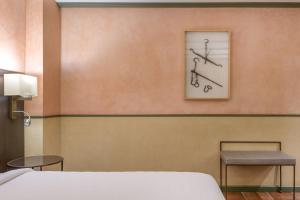 Postel nebo postele na pokoji v ubytování AC Hotel Ciudad de Toledo by Marriott