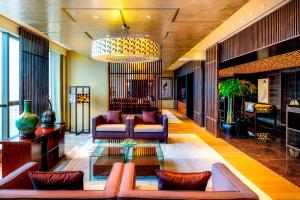 a living room with a couch and a table at The Westin Beijing Chaoyang in Beijing