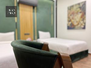 Postel nebo postele na pokoji v ubytování Elite Boutique Hotel