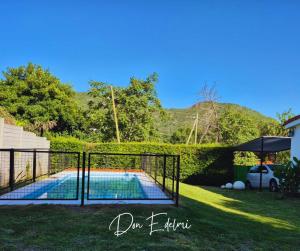 a swimming pool in the yard of a house at Don Edelmi in Villa Carlos Paz +17 photos