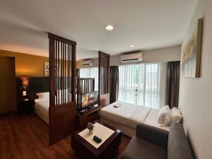 מיטה או מיטות בחדר ב-Greenage MingSuite 明绿时代套房 Kota Kinabalu 亚庇市中心