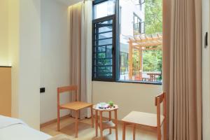 Fotografija v galeriji nastanitve Phoenix Ancient City Courtyard Hotel凤凰古城庭院酒店 v mestu Fenghuang