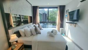 TV o dispositivi per l'intrattenimento presso B506-top Floor Pool View 1 Br At Ao Nang Beach
