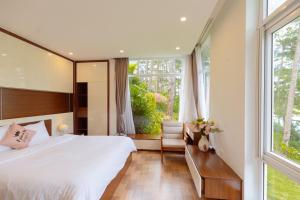 Ένα ή περισσότερα κρεβάτια σε δωμάτιο στο Rose villa 35d2 Đà lạt