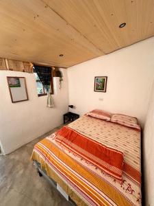 Postel nebo postele na pokoji v ubytování Cabaña del Ciprés