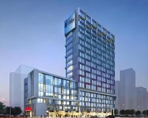 an artist rendering of a tall building at Cloud&Sea Inn in Shenzhen