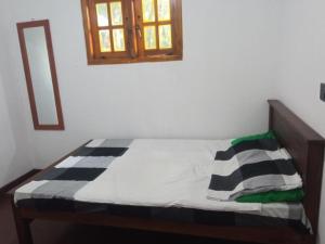 Postel nebo postele na pokoji v ubytování Riverston Green Parrot Villa