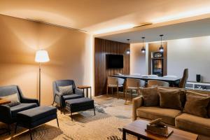 a living room with a couch and a table at Four Points by Sheraton Mexico City Colonia Roma in Mexico City