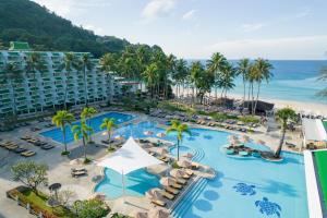 an aerial view of a resort with a pool and the ocean at Le Meridien Phuket Beach Resort in Karon Beach