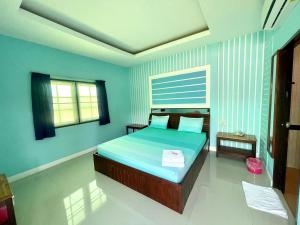 Postel nebo postele na pokoji v ubytování Navy Resort