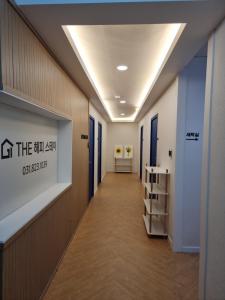 an office hallway with a sign on the wall at The Happy Stay in Uijeongbu