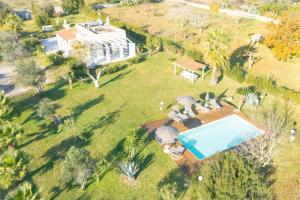 an aerial view of a house with a swimming pool at Villa Assunta With Pool Near The Sea - Happy Rentals in Melendugno