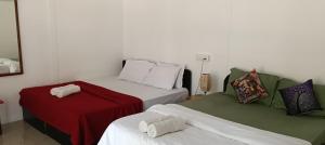 Letto o letti in una camera di Casa Beach hut Resort