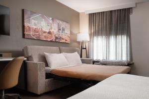 a hotel room with a couch and a window at SpringHill Suites by Marriott Little Rock in Little Rock +11 photos