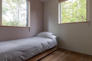 Postel nebo postele na pokoji v ubytování Rinrei terrace 一棟貸切 シングルルーム6部屋 各部屋トイレ シャワー付