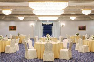 a banquet hall with tables and chairs and a room at Sheraton Jeddah Hotel in Jeddah +80 photos
