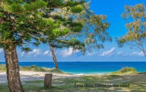 a view of the ocean from the beach at Shoreline Luxe - Refined Beachside Elegance with Spa in Caves Beach