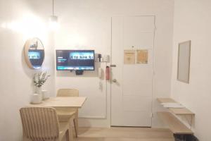 TV a/nebo společenská místnost v ubytování VG Pension and Residences