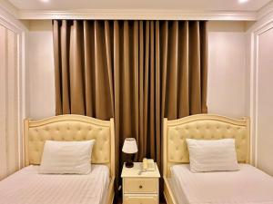 Postel nebo postele na pokoji v ubytování Maya Hotel 2