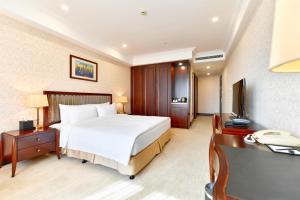 Letto o letti in una camera di Evergreen Laurel Hotel, Shanghai