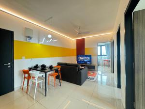 a living room with a table and a couch at X - The Papermill - Sunway Subang Jaya USJ1 SEGi Monash INTI Taylor Sunway Lagoon in Subang Jaya