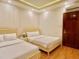 Postel nebo postele na pokoji v ubytování Maya Hotel 2