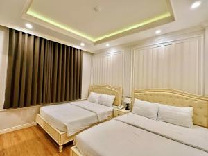 Postel nebo postele na pokoji v ubytování Maya Hotel 2