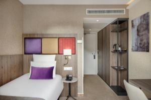 Postel nebo postele na pokoji v ubytování Mercure Budapest Korona