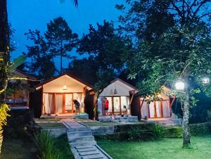 a villa with a view at night at Waroeng Senaru Cottages in Senaru