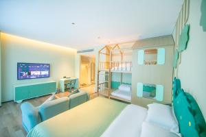 Voodi või voodid majutusasutuse Chaozhou Yuyu Hotel toas