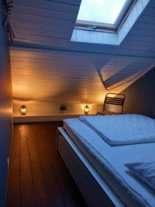 Postel nebo postele na pokoji v ubytování L'Atelier - Gîte urbain chaleureux