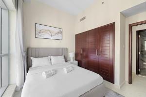 Postel nebo postele na pokoji v ubytování Boulevard Central 2 by Luxstay Holiday Homes